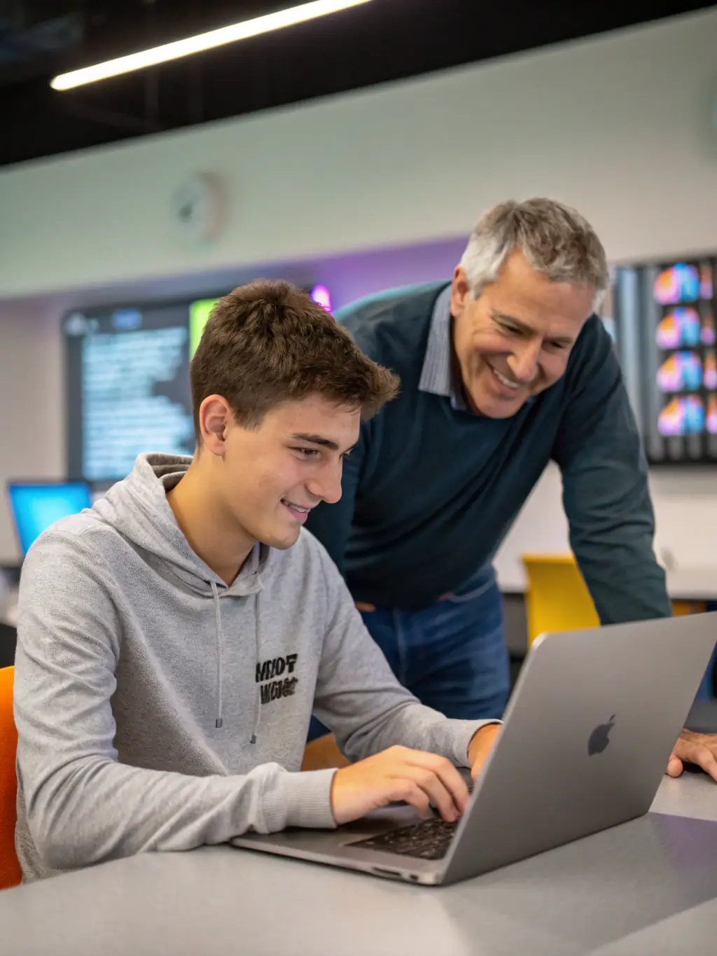 A young Indian professional receiving career advice from a mentor in a co-working space, emphasizing growth and development.